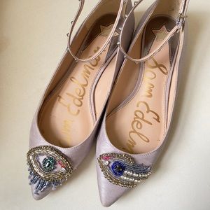 Embellished flats with ankle strap.